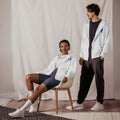 Unisex zip hoodie made from 95% recycled polyester with relaxed fit and double-lined hood