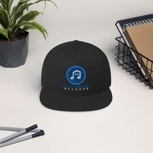 High-profile flat bill cap with green undervisor and snapback closure